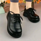 Zapatos de cuero suave con suela gruesa